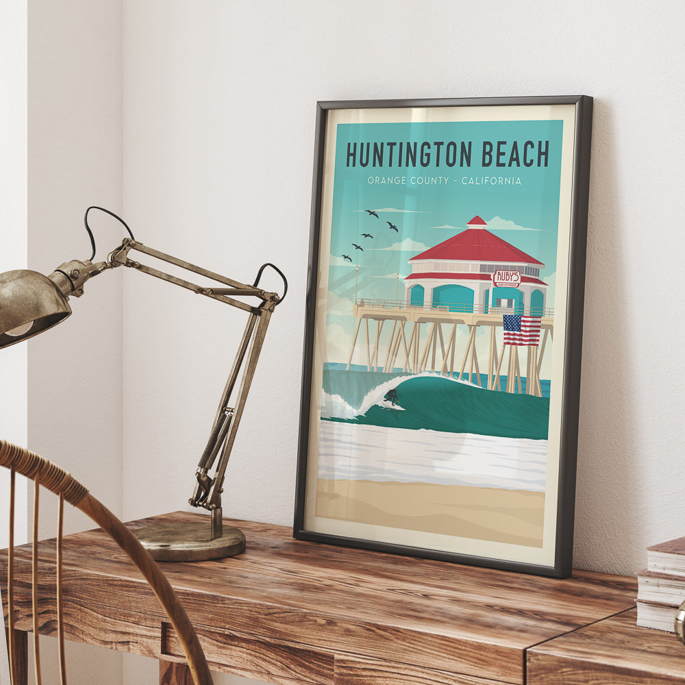Framed California vintage surf poster on office desk
