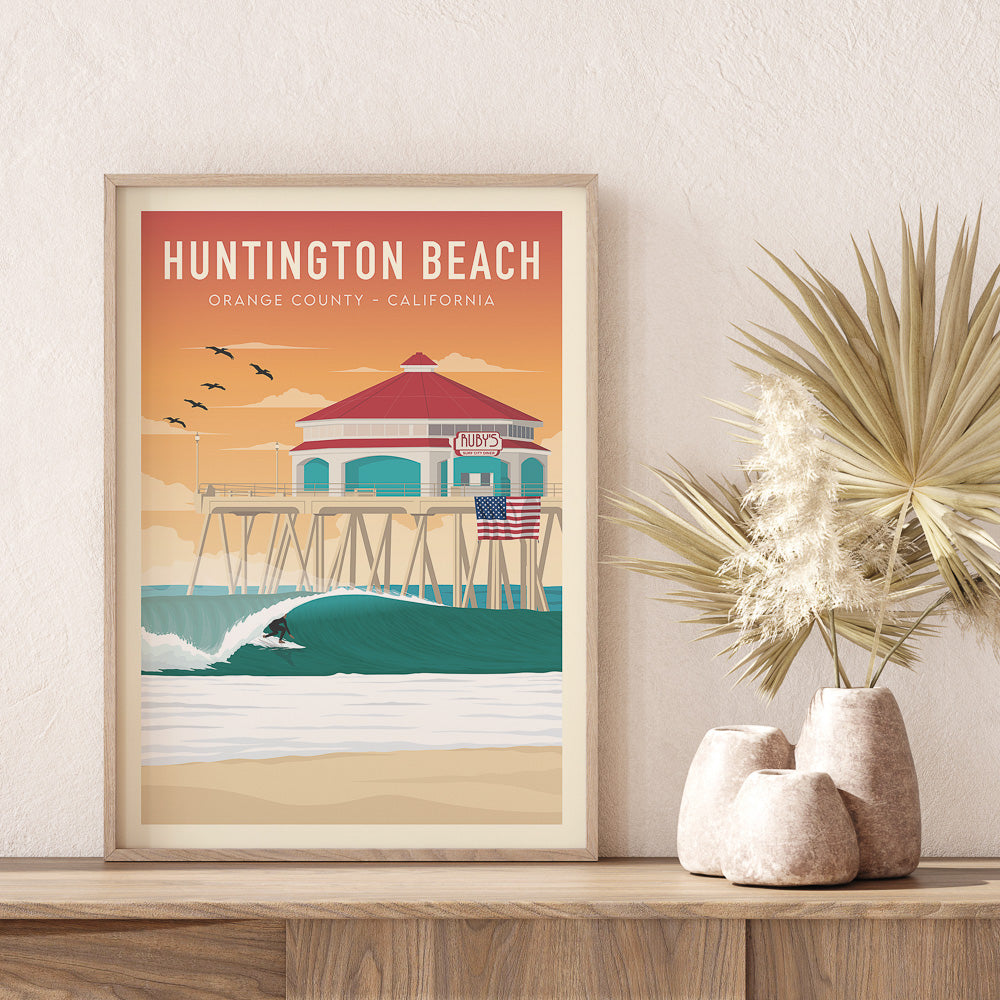 Wooden framed print of Huntington Beach Pier in california with dried flower in vase